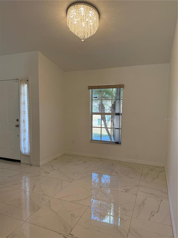 4688 Heather Terrace North Port, FL 34286 - Photo 8 of 35 an empty room with windows