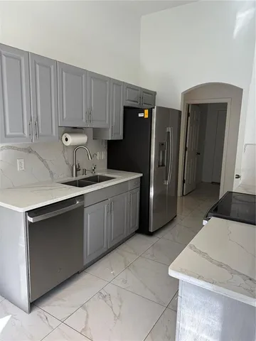 a kitchen with a sink and a stove
