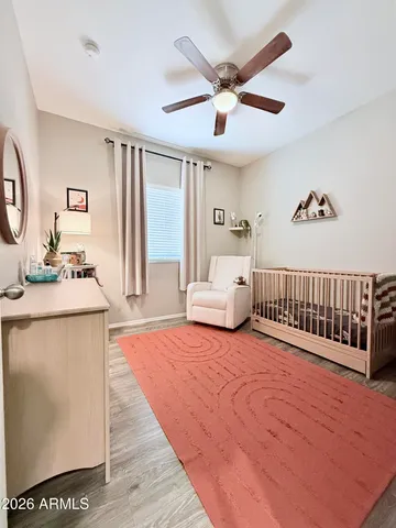 a spacious bedroom with a bed and a window