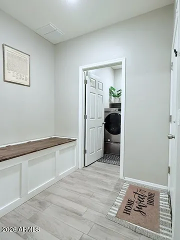 a bedroom with a bed and a mirror