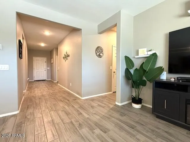 a view of livingroom with hardwood floor and a flat screen tv