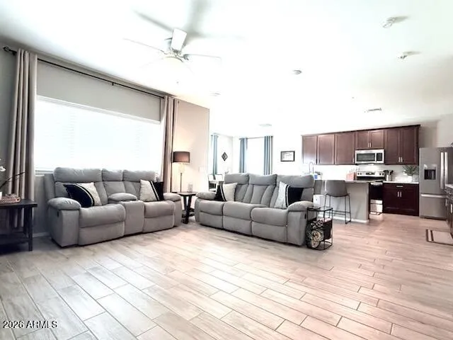 a living room with furniture and a large window