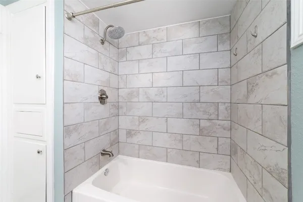a bathroom with a toilet a sink a vanity and mirror