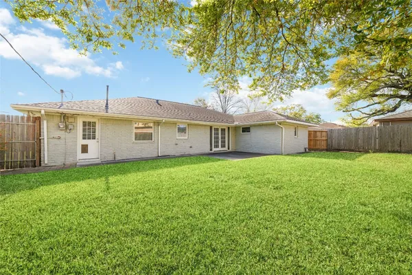 a view of a house with a back yard