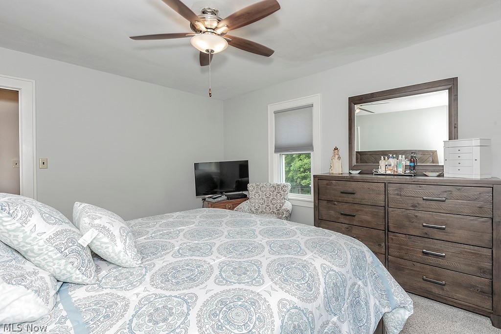 2480 Eaton Road Cleveland, OH 44118 - Photo 24 of 41 Bedroom with light colored carpet and ceiling fan