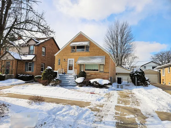 a view of a house with snow on the roof