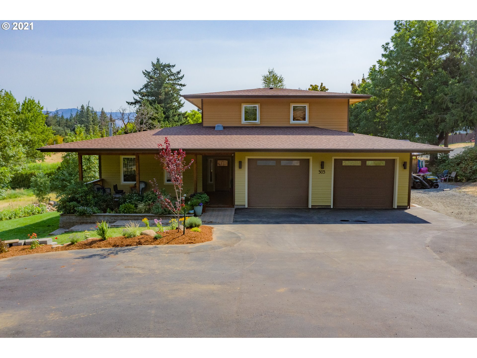 a front view of a house with a yard