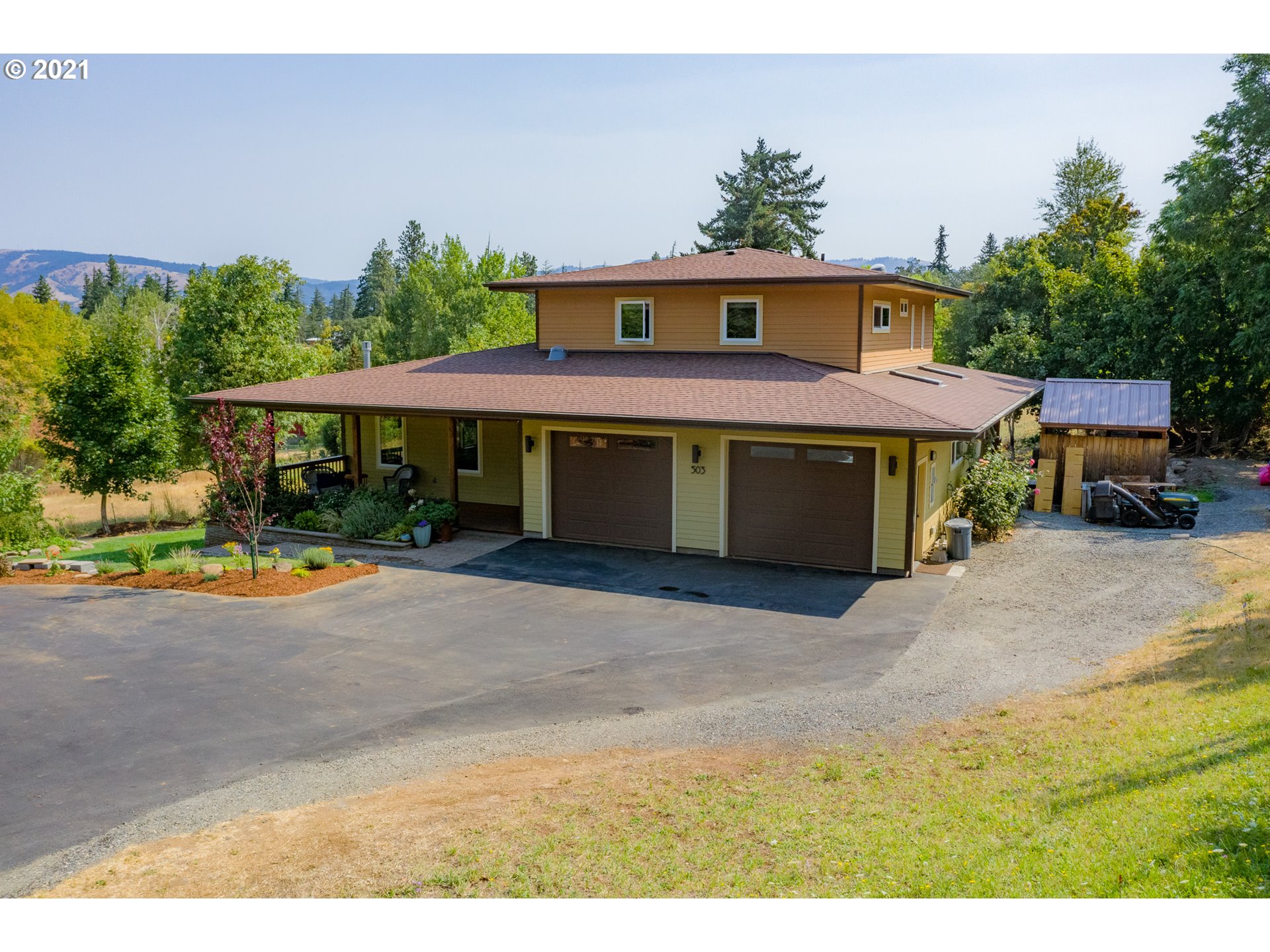 503 Frankton Road Hood River, OR 97031 - Photo 2 of 31 a front view of a house with a yard and garage