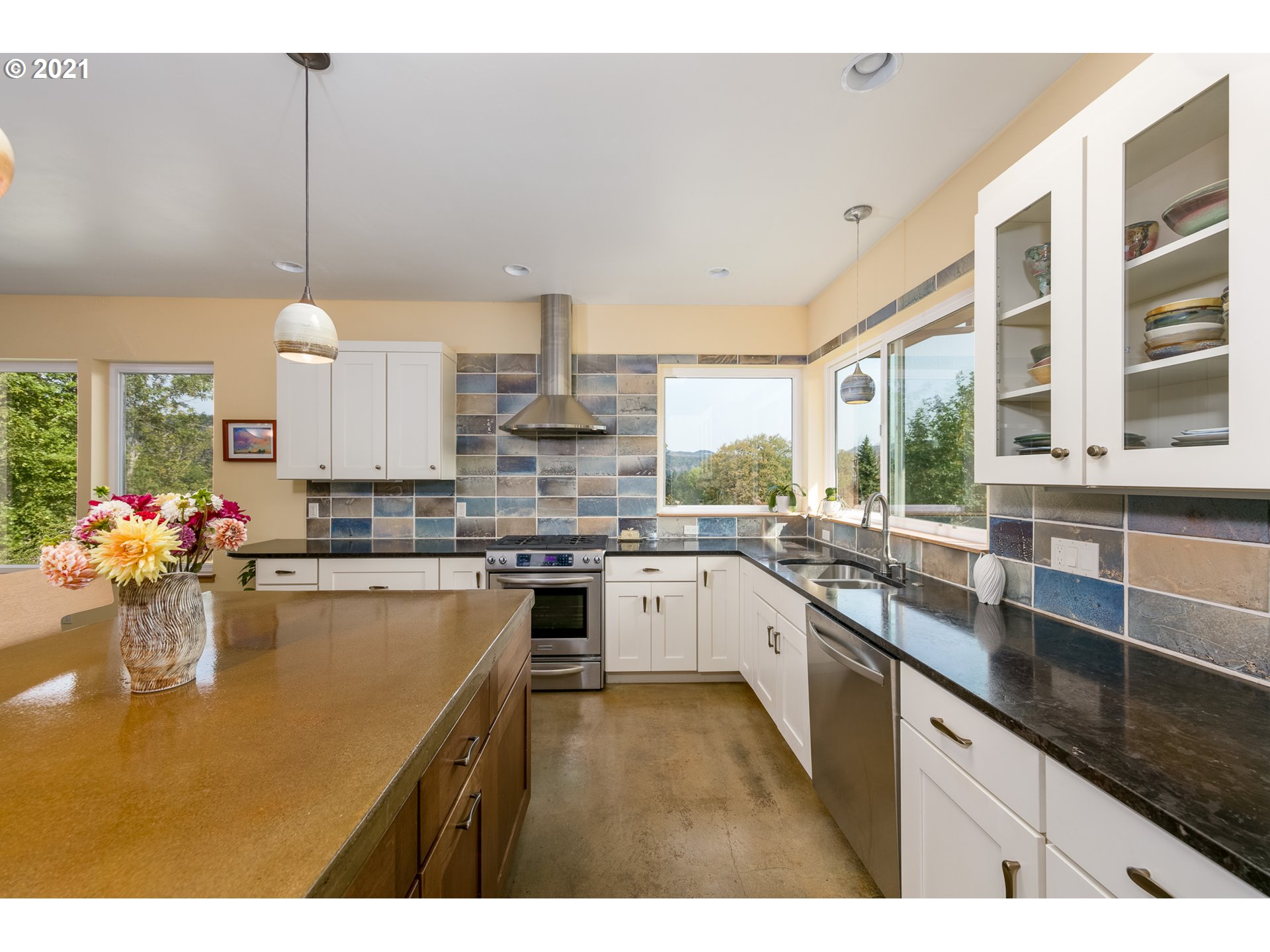 503 Frankton Road Hood River, OR 97031 - Photo 11 of 31 a kitchen with stainless steel appliances granite countertop a sink a stove and a wooden floors