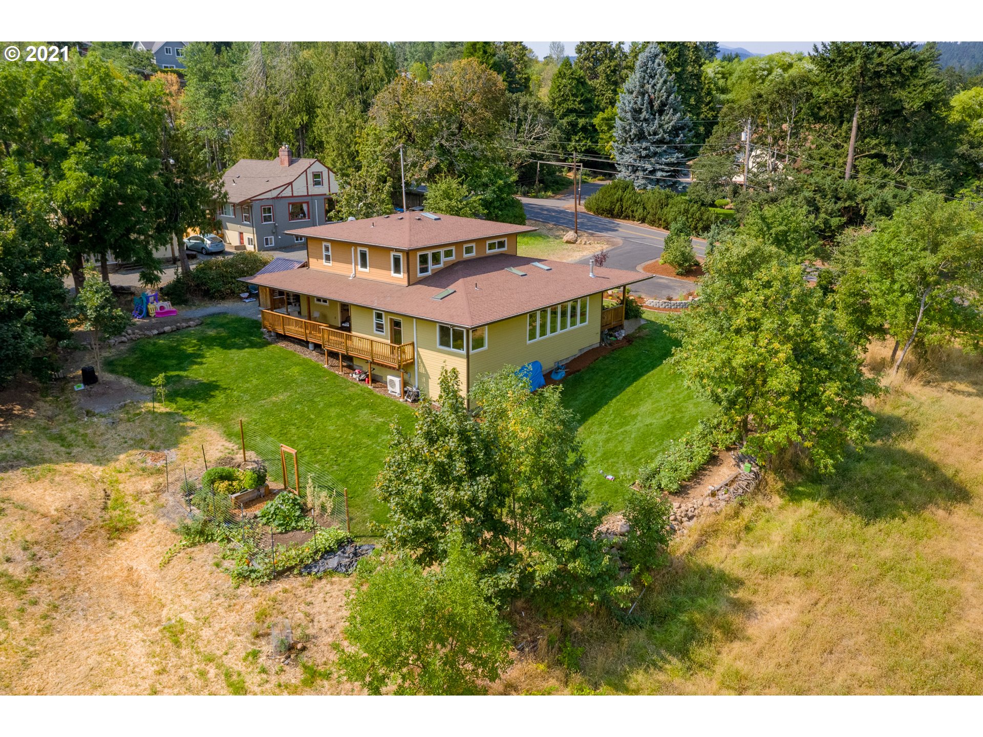 503 Frankton Road Hood River, OR 97031 - Photo 4 of 31 a backyard of a house with a yard and outdoor seating