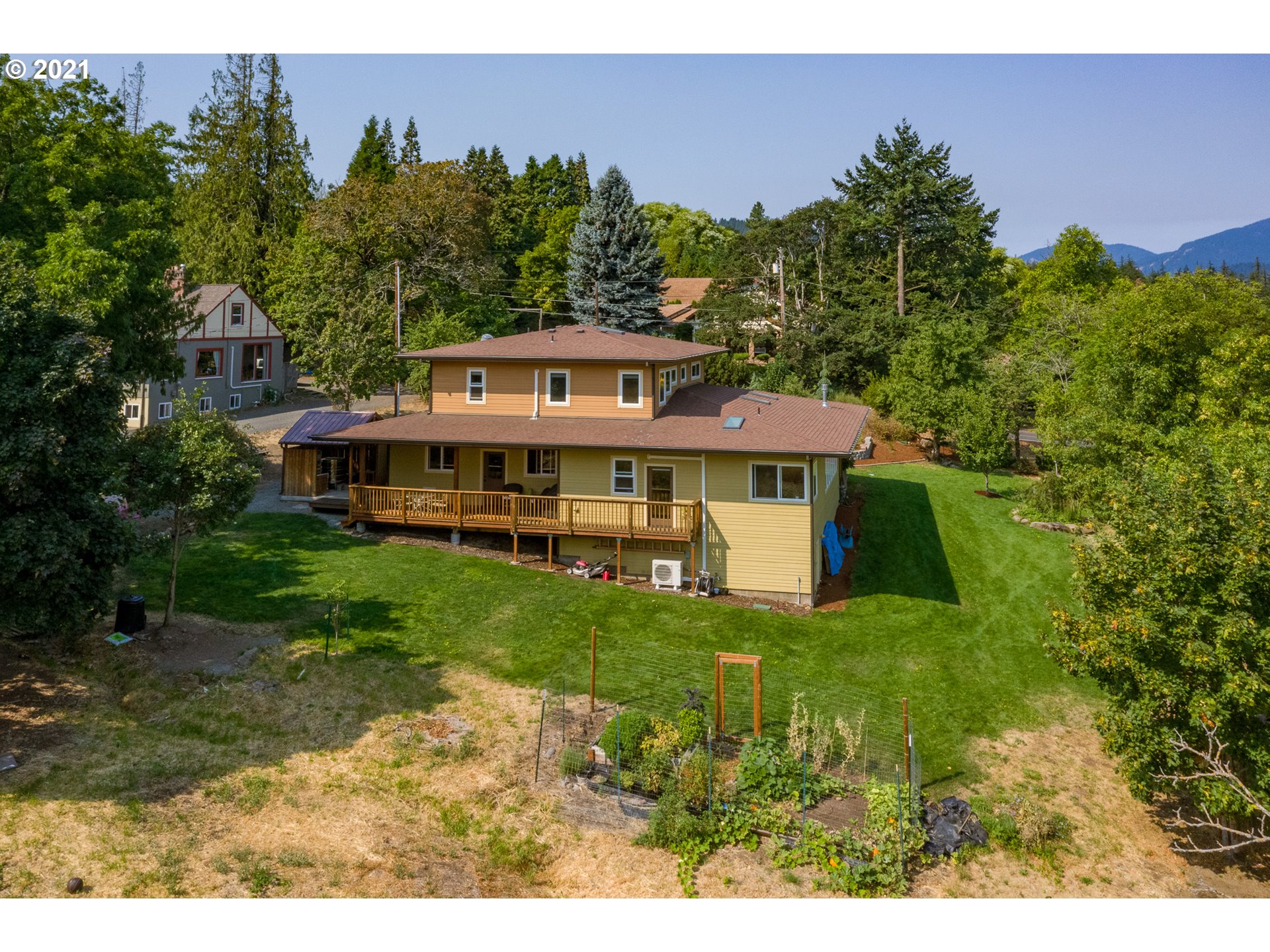 503 Frankton Road Hood River, OR 97031 - Photo 5 of 31 a front view of a house with a garden