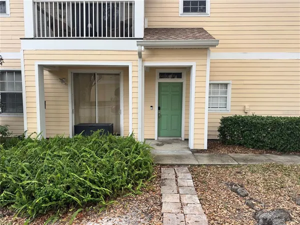 a view of a house with a door and a window