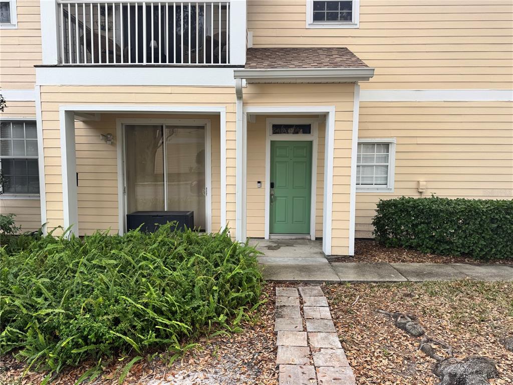 6315 Rosefinch Court, Unit 101 Lakewood Ranch, FL 34202 - Photo 1 of 30 a view of a house with a door and a window