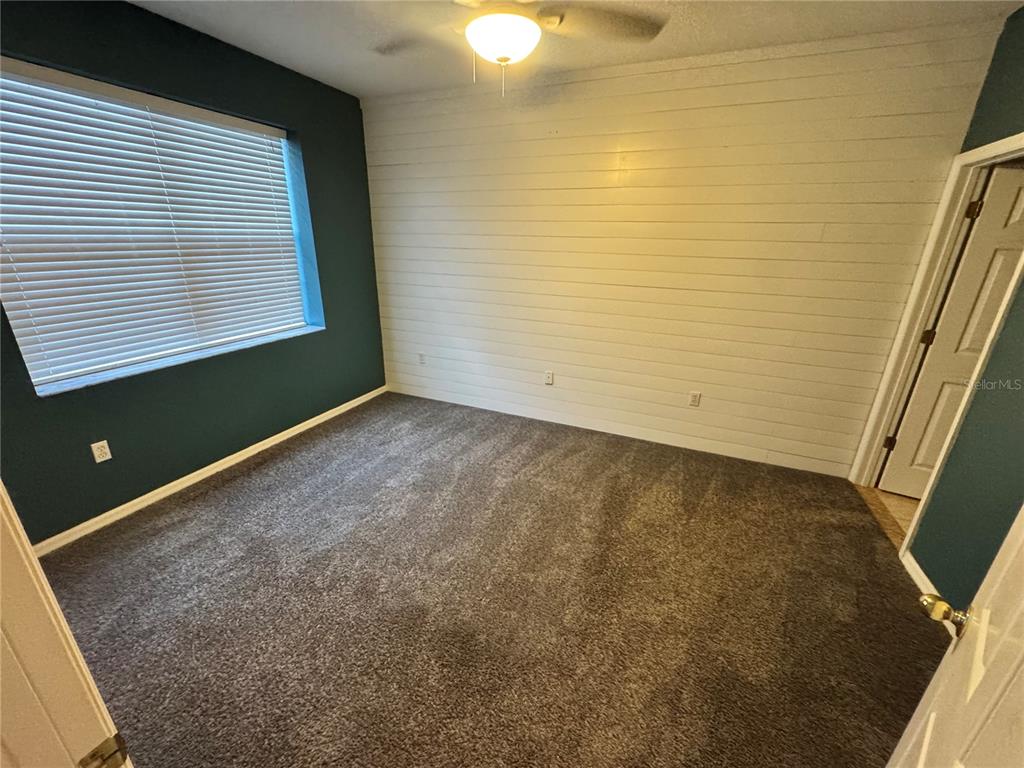 6315 Rosefinch Court, Unit 101 Lakewood Ranch, FL 34202 - Photo 19 of 30 a view of an empty room with a window