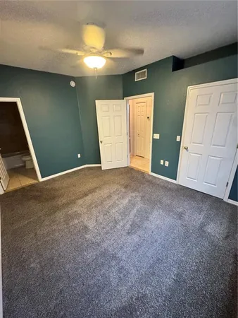 a view of an empty room with a fireplace