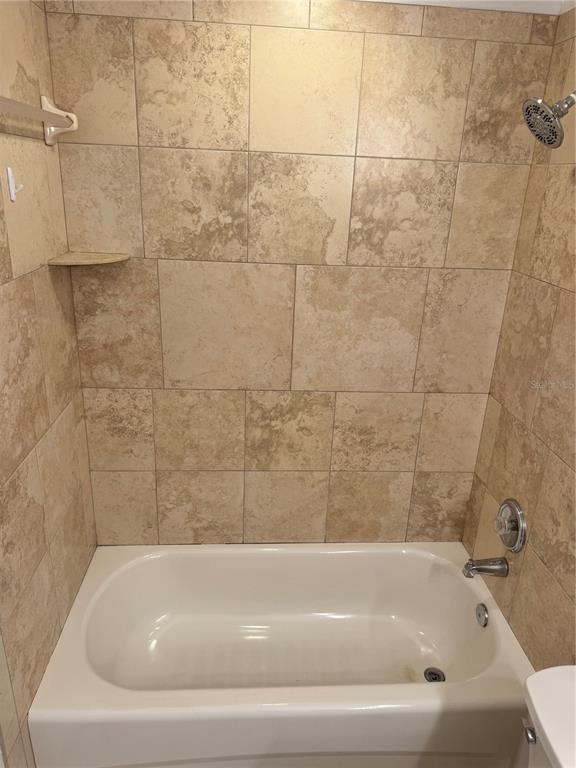 6315 Rosefinch Court, Unit 101 Lakewood Ranch, FL 34202 - Photo 23 of 30 a bathroom with a bathtub