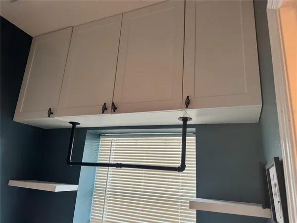 a view of a room with racks on the wall