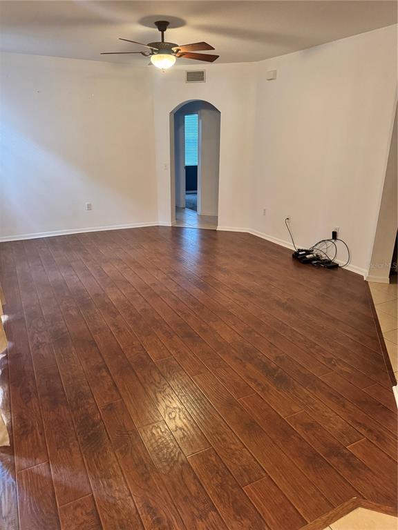 6315 Rosefinch Court, Unit 101 Lakewood Ranch, FL 34202 - Photo 7 of 30 wooden floor in an empty room with a window