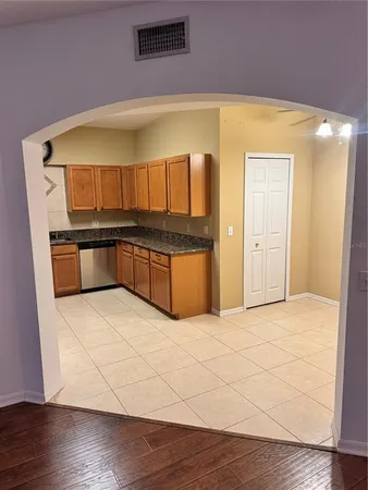 a view of kitchen and wooden floor
