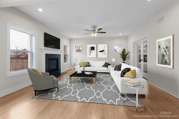 a living room with furniture or couch and a fireplace