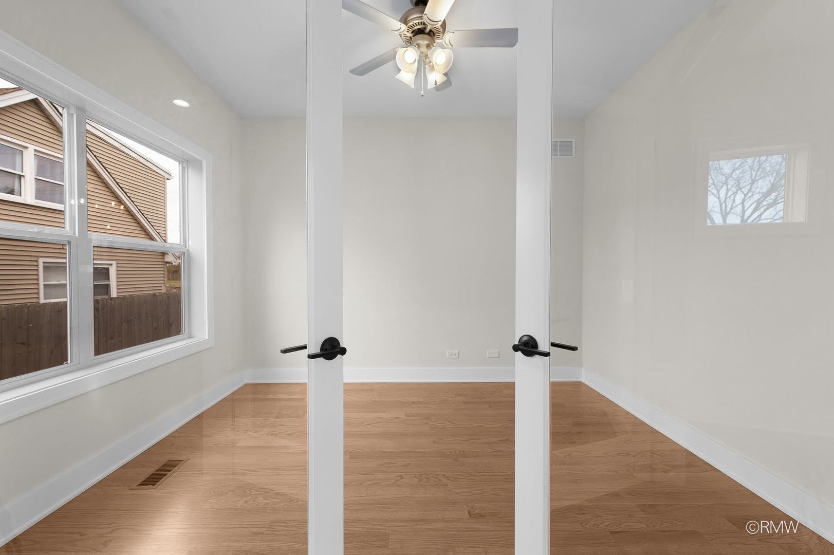 25-w275 Doris Avenue Carol Stream, IL 60188 - Photo 15 of 34 a view of a hallway with wooden floor and a ceiling fan