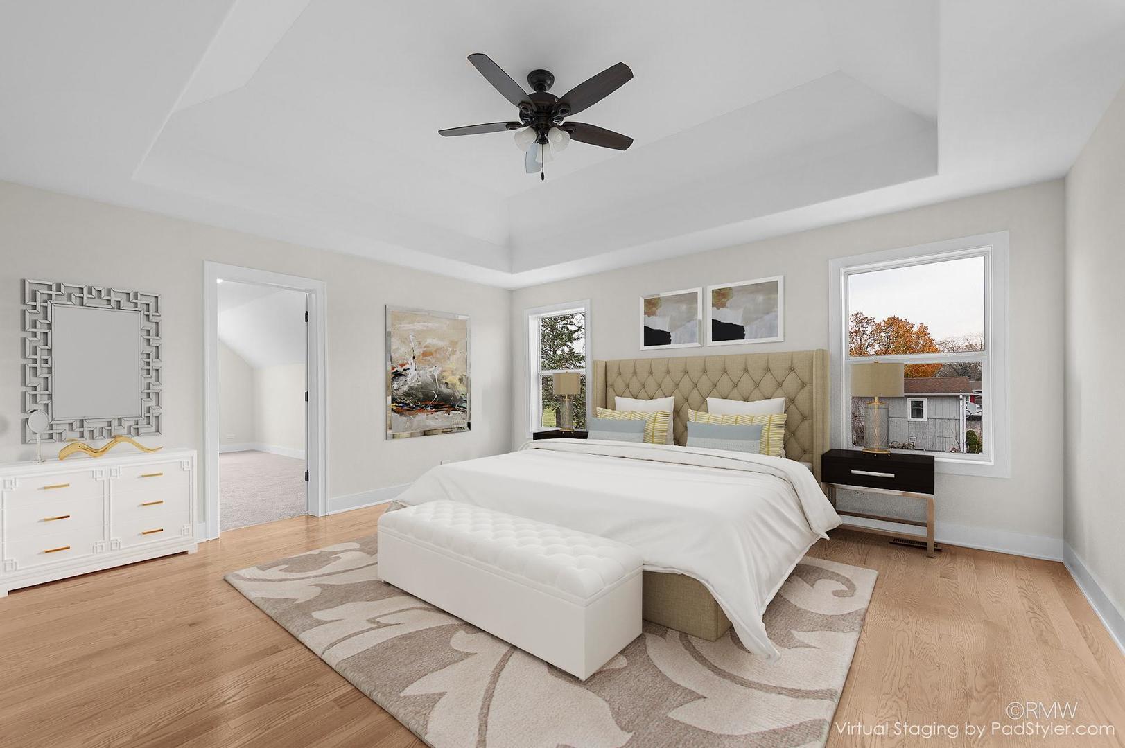 25-w275 Doris Avenue Carol Stream, IL 60188 - Photo 20 of 34 a bedroom with a large bed and a chandelier