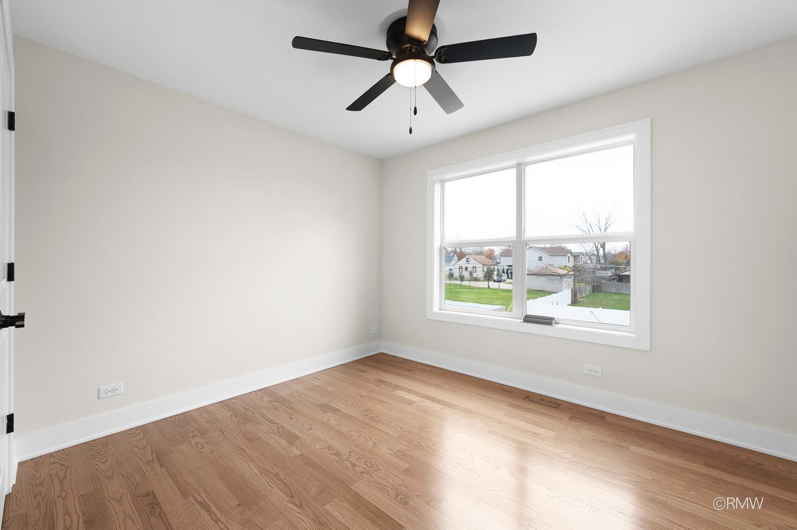 25-w275 Doris Avenue Carol Stream, IL 60188 - Photo 28 of 34 an empty room with a window and a ceiling fan