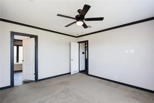 a view of a livingroom with a ceiling fan