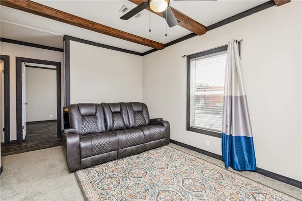 a living room with furniture and a window