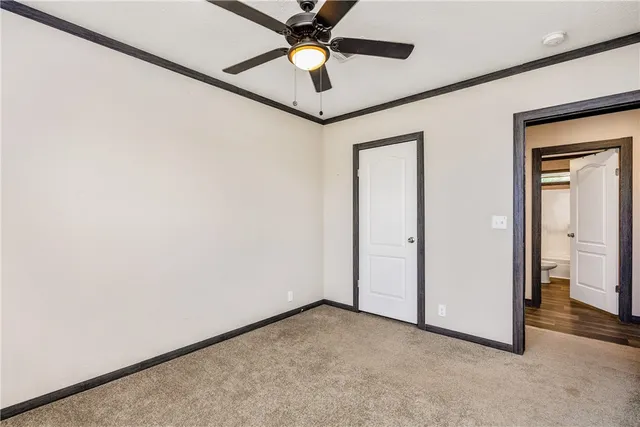 a view of livingroom with hardwood floor and a ceiling fan
