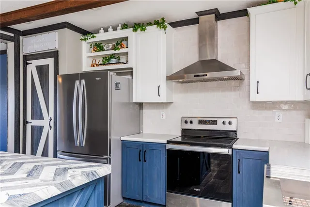 a kitchen with stainless steel appliances granite countertop a stove a refrigerator and a wooden cabinets