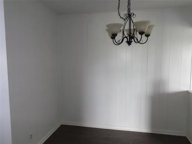 a view of small space with wooden floor and windows