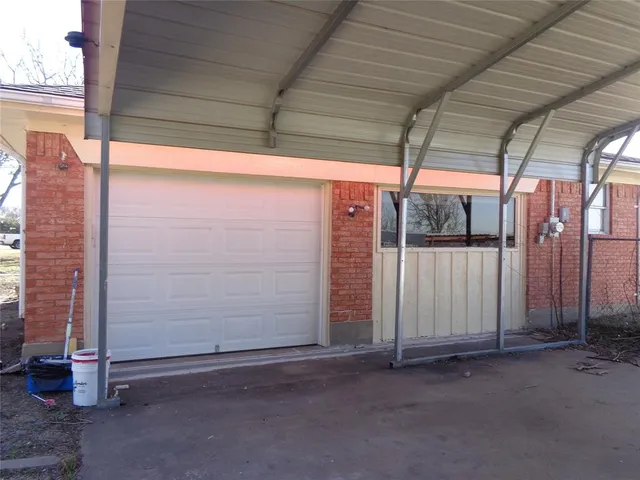 a view of a room with wooden walls