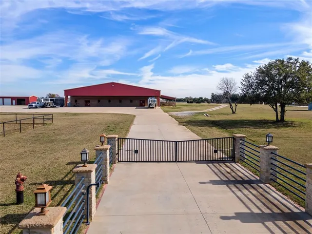 a view of a gym room with lots of wooden furniture