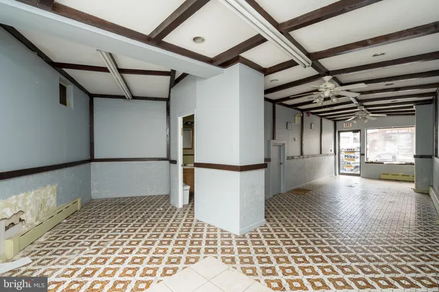 a bathroom with a sink a toilet and shower curtain