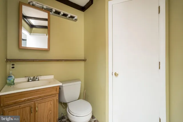 a balcony with furniture and a potted plant