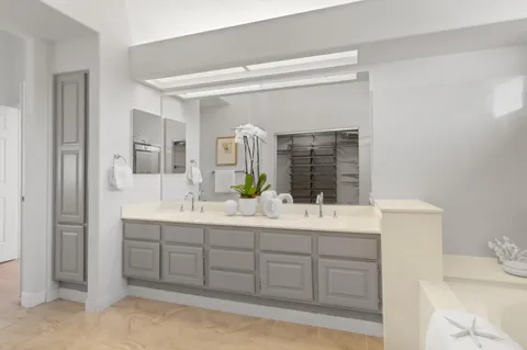 a bedroom with a bed and a large window with outer view