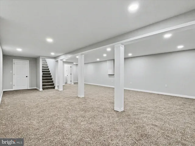 a view of an empty room with a hallway