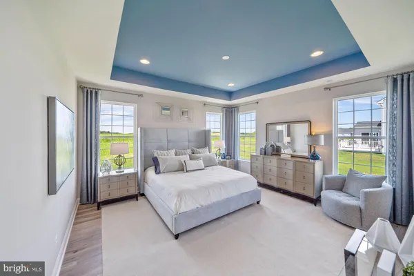 a bedroom with a bed and a couch