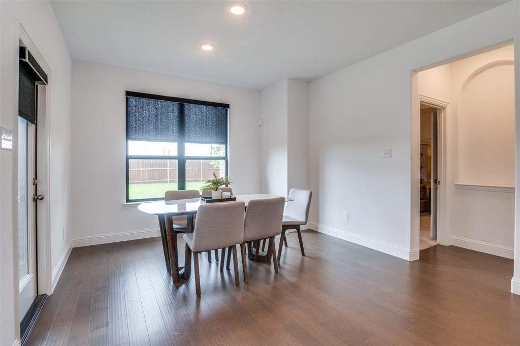 1749 Wassel Road Fort Worth, TX 76052 - Photo 11 of 25 a view of a dining room with furniture window and wooden floor