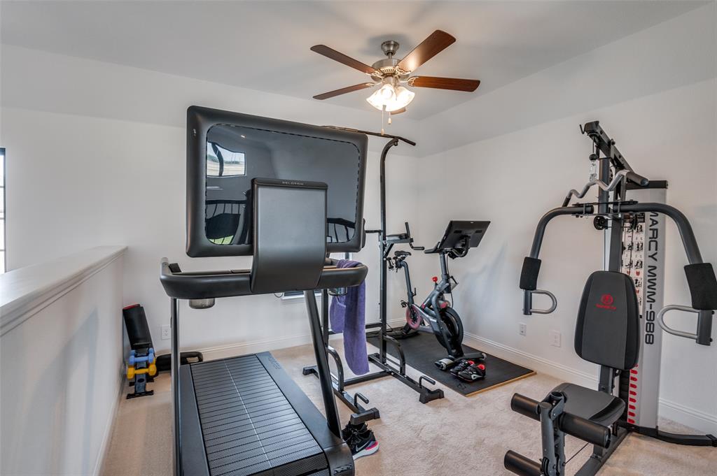 1749 Wassel Road Fort Worth, TX 76052 - Photo 19 of 25 a view of a room with gym equipment