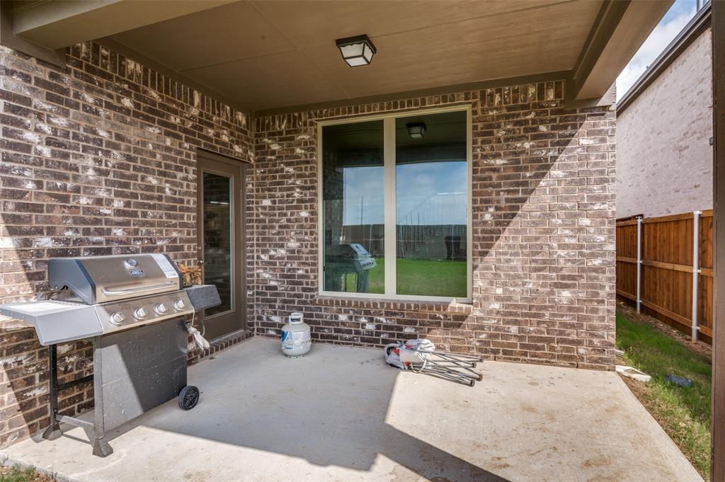 1749 Wassel Road Fort Worth, TX 76052 - Photo 24 of 25 a front view of a house with outdoor seating