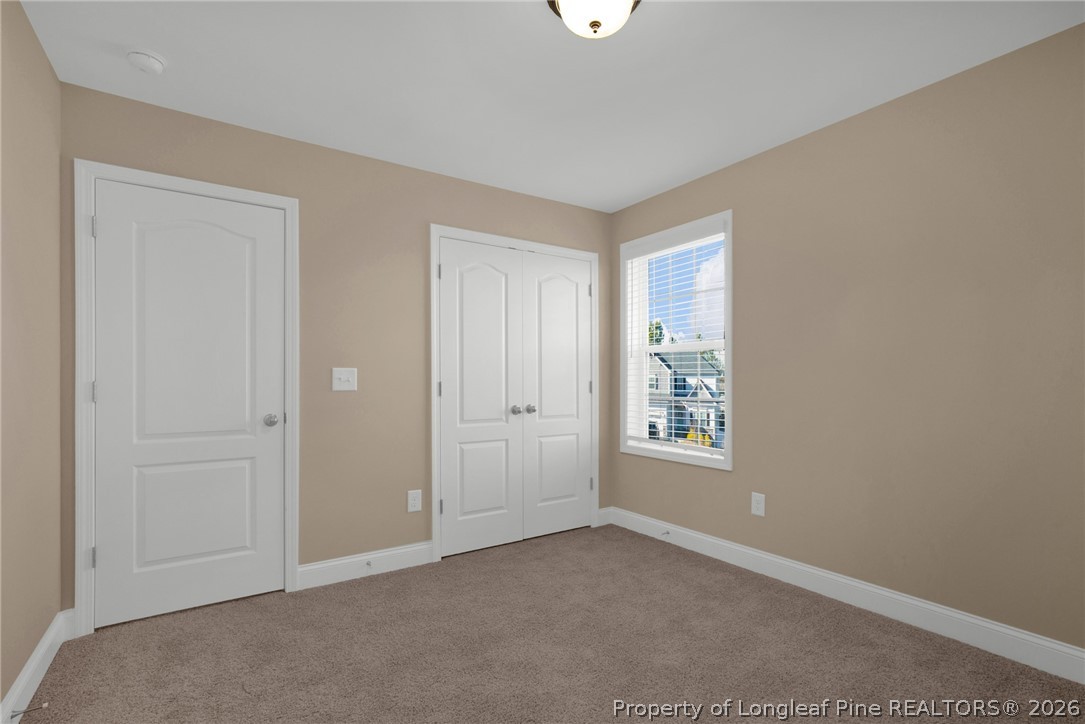 448 Pittfield Run Cameron, NC 28326 - Photo 21 of 43 an empty room with windows and closet