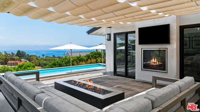 a view of outdoor sitting space with furniture