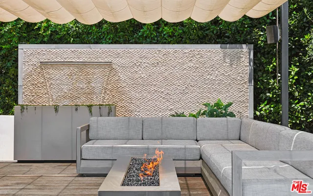 a bathroom with a granite countertop sink a toilet a mirror and shower