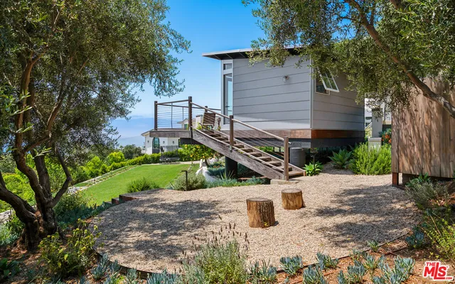 a view of a chairs and table on the terrace