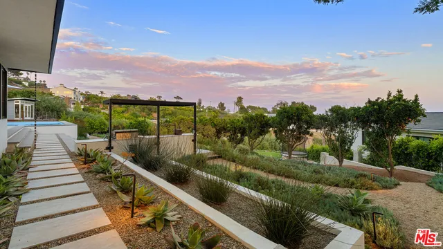 an aerial view of a house with a big yard