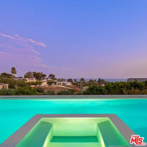 a view of a house with a swimming pool