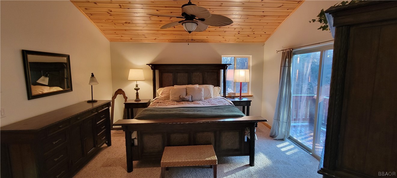 1685 Angels Camp Road Big Bear City, CA 92314 - Photo 15 of 35 a view of a dining room with furniture and a chandelier