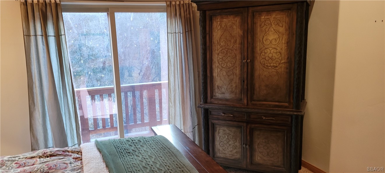 1685 Angels Camp Road Big Bear City, CA 92314 - Photo 17 of 35 a bedroom with a bed and a window